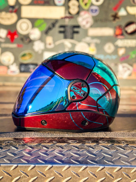 Cookie C45 skydiving helmet in a red and blue custom finish on a workshop platform